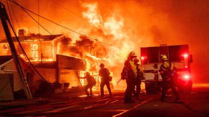 Firefighters battle the Palisades Fire in Los Angeles&#039; Pacific Palisades on Jan. 7, 2025.