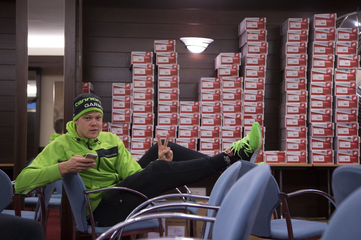 Lasse Norman Hansen relaxing in front of the New Balance shoe wall