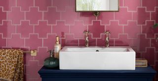pink geometric shaped tiles in a bathroom behind the vanity unit to show the biggest bathroom trends 2023