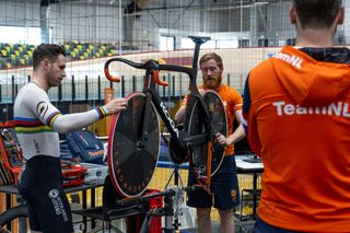 Head mechanic Tim de Boer wipes a Dugast tyre down