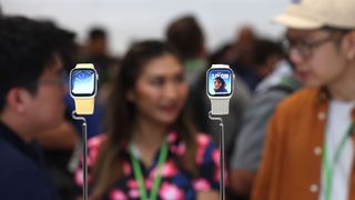 Two Apple Watches on display at an Apple event