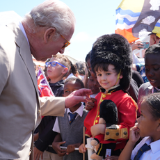King Charles III speaks to well-wishers during a ceremonial welcome at King's Square on May 1, 2026 in St. George's, Bermuda