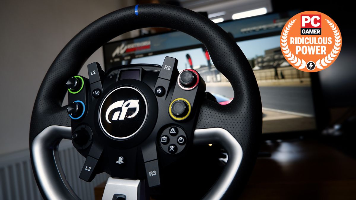 The Fanatec GT DD Pro racing wheel and wheelbase on a desk with monitor playing Assetto Corsa behind.