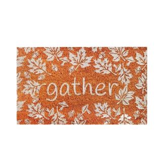 A white and orange door mat that says 