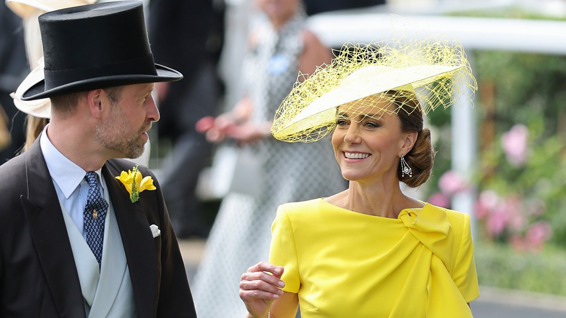 Princess Kate wearing a bright yellow dress and a matching hat for Royal Ascot Day 2 in 2026, while Prince William wears a traditional suit with a top hat