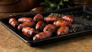 Pigs in blankets with thyme and bay leaves