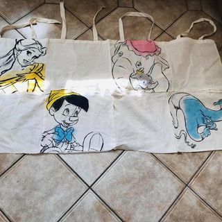 square shaped tiles with cartoon pictures on disney tote bags