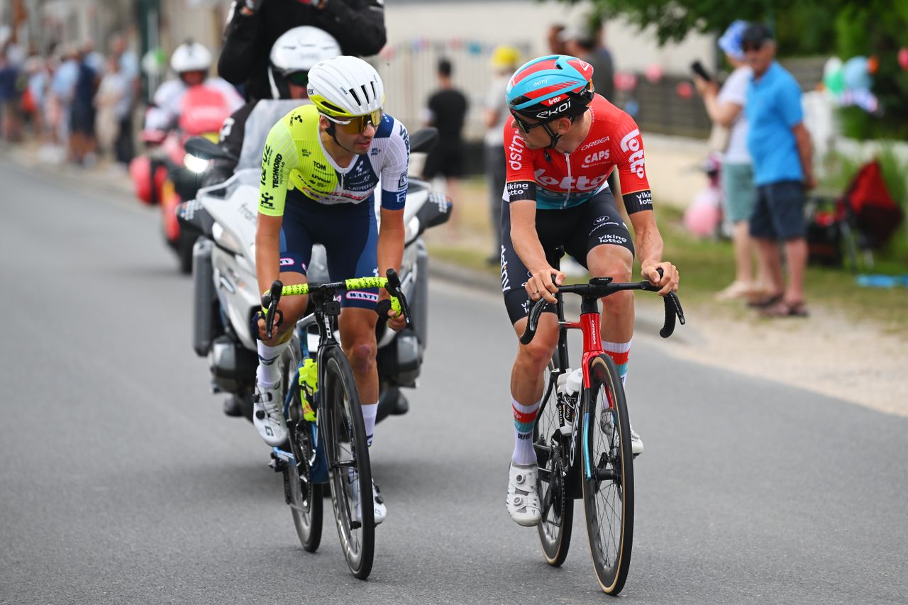 Two male riders, one riding for Intermarché-Wanty, the other for Lotto, at the 2024 Tour de France