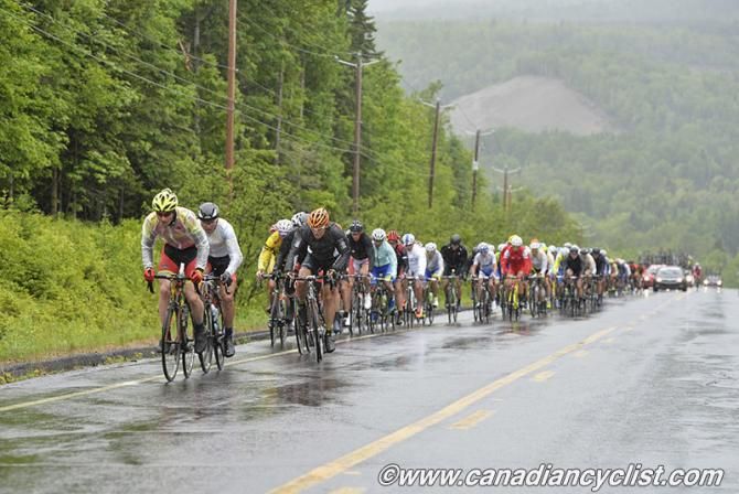 eloton struggles on the climb in the rain