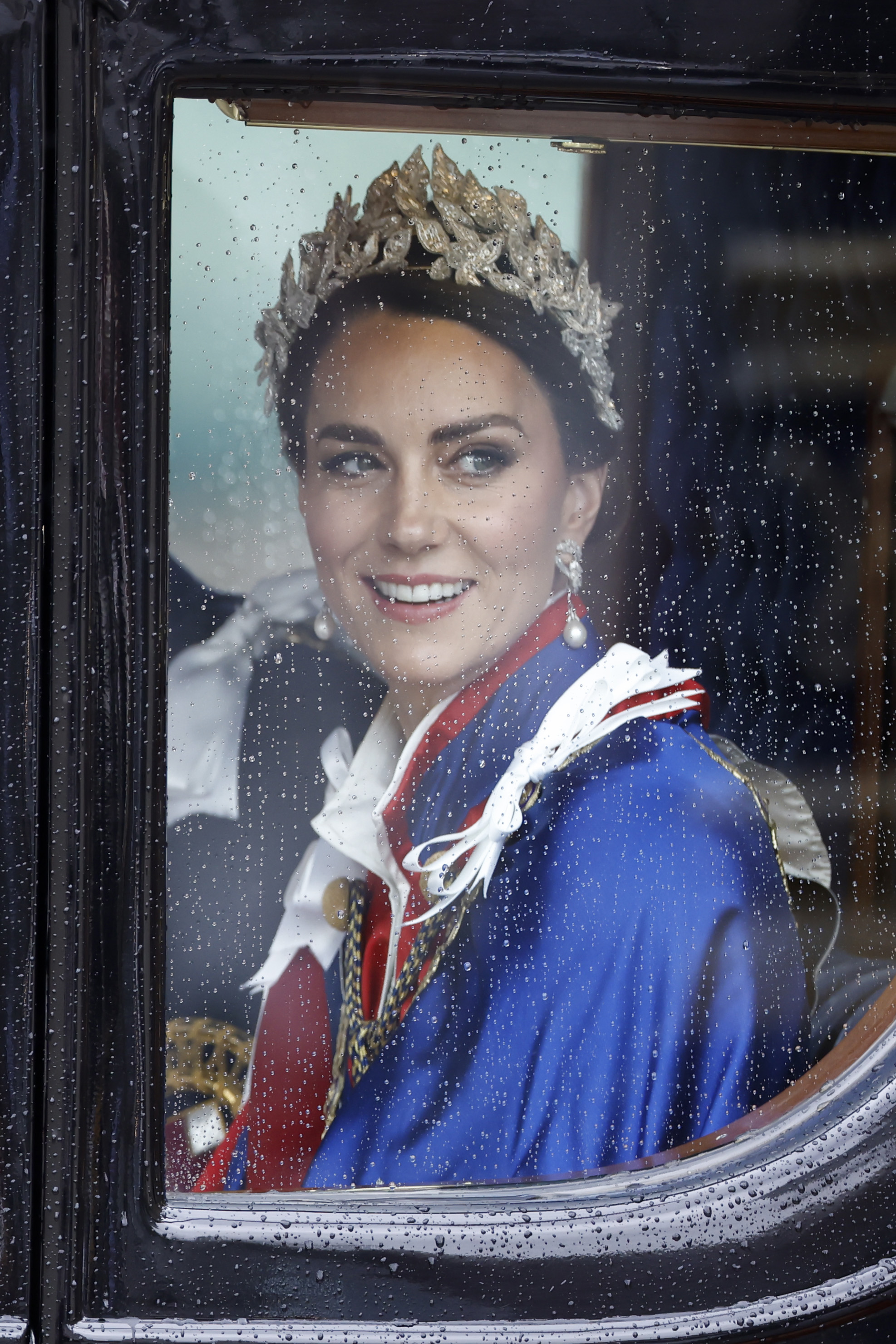 The Princess of Wales photographed through a carriage window on her way to The King's coronation