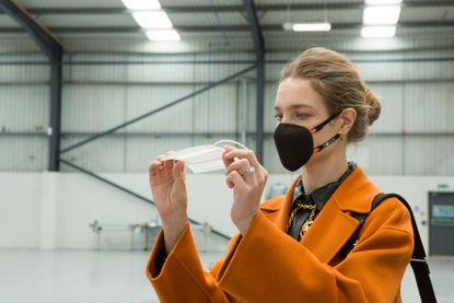 Natalia Vodianova wearing the masuku one face mask in the laboratory