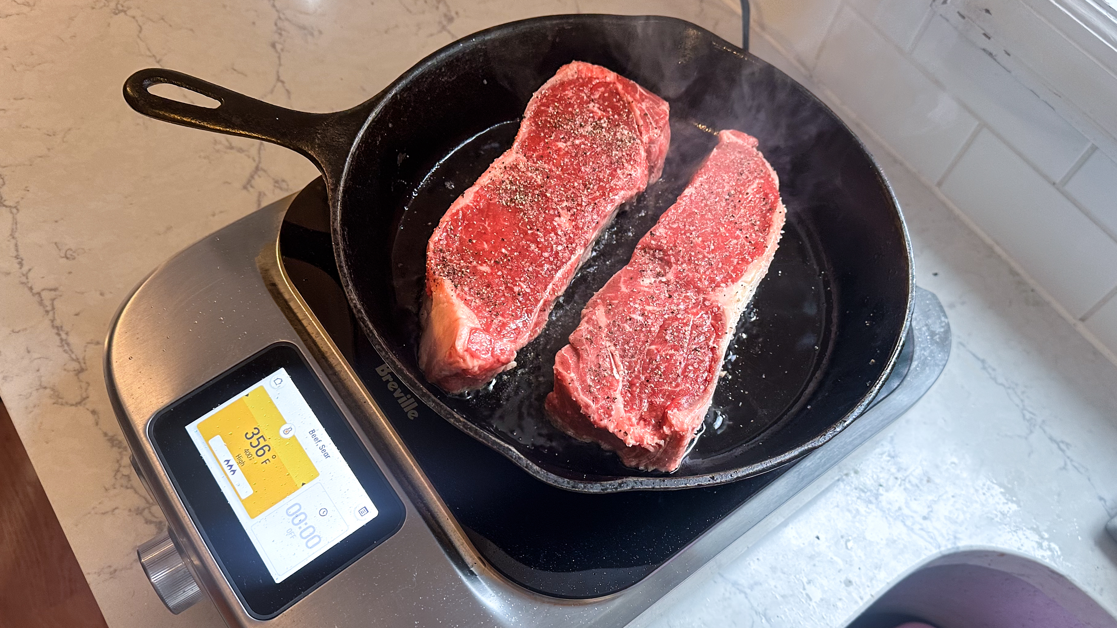 cooking steaks in the Breville Control Freak induction cooktop