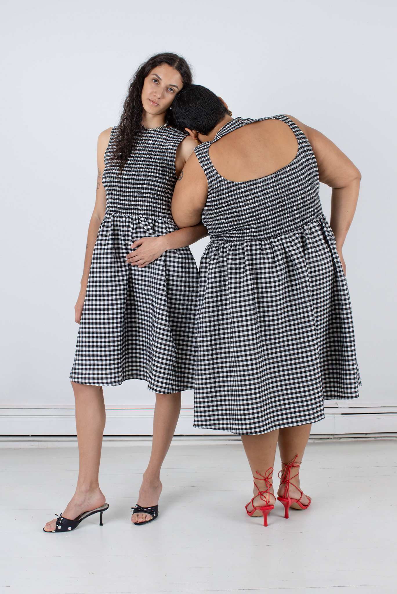 two models wearing Wray gingham dresses