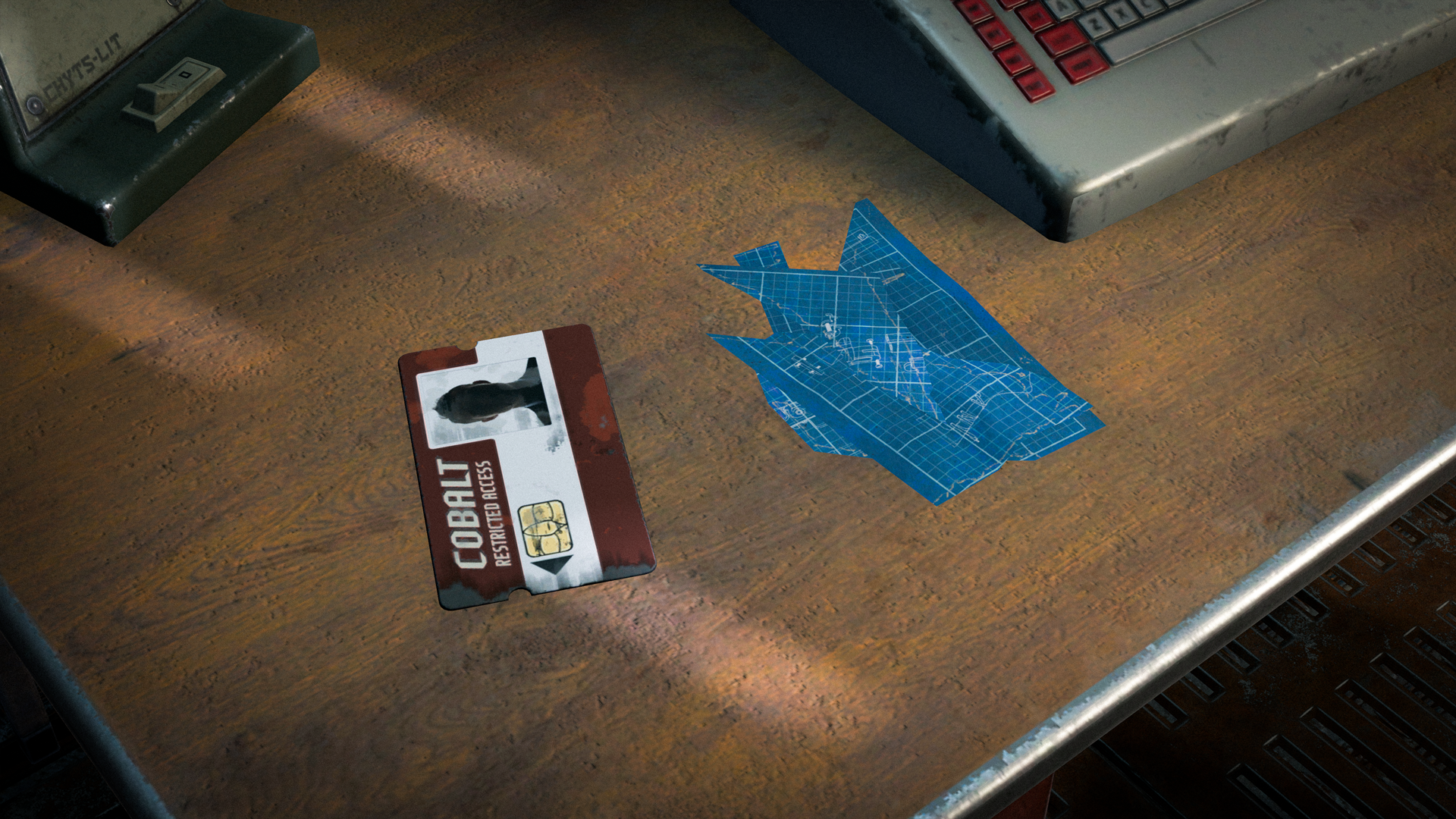 The Blueprint Fragments added to Rust sitting on a desk beside a keycard