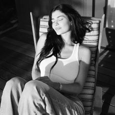 kylie jenner wears a tank top and jeans with her cartier diamond watch