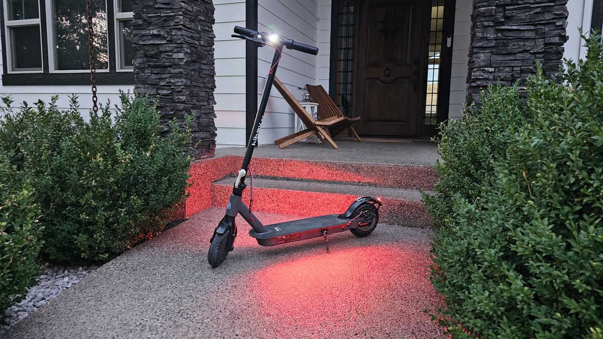 The Hiboy S2 e-scooter outside a house.