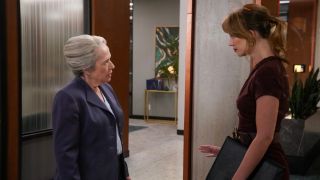 Kathy Bates confronts Yael Grobglas in an office doorway in Matlock S1 E11, 