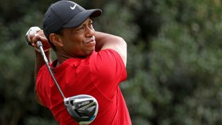 Tiger Woods, seen here playing his shot from the 15th tee during the final round of the Masters at Augusta National Golf Club, will play in the 2022 Masters
