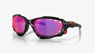 A black pair of sunglasses with colourshift red and purple lenses against a white background
