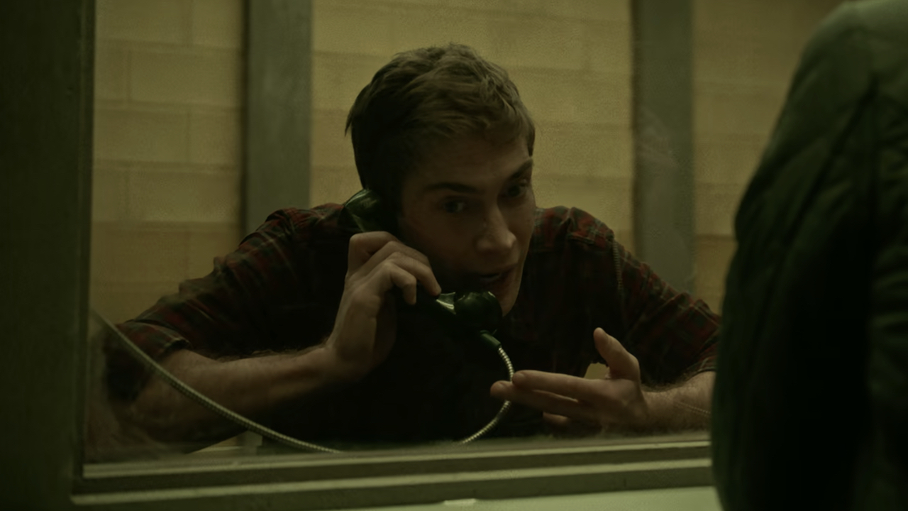 Screenshot of Cyrus on the phone in prison in It's What's Inside