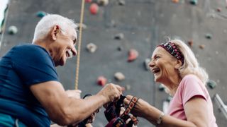 Couple indoor rock climbing