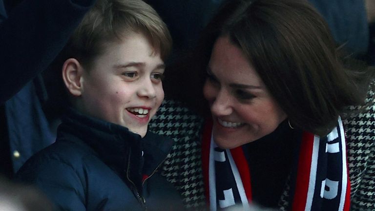 Britain's Prince George of Cambridge (L) talks to his mother Britain's Catherine, Duchess of Cambridge as they attend the Six Nations international rugby union match between England and Wales at Twickenham Stadium, west London