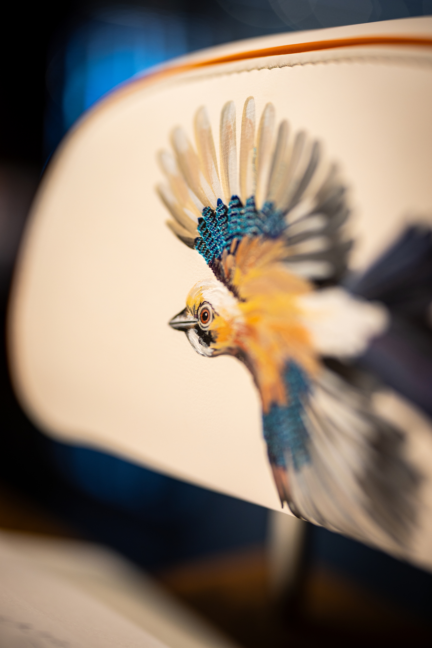 Images of Rolls Royce craftspersons creating a triptych of nature scenes featuring a kingfisher