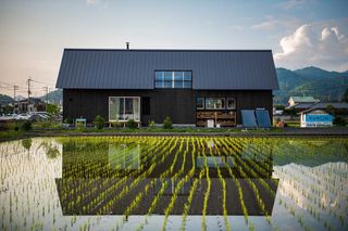Farm House of Winds and Fire exterior with paddy fields
