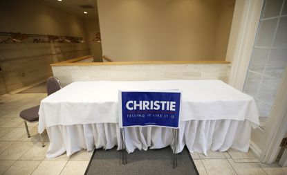 Yard signs for New Jersey Gov. Chris Christie sit in a hallway in Iowa City, Iowa.