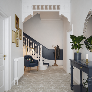 upstairs with white wall and flooring with hexagonal tiles
