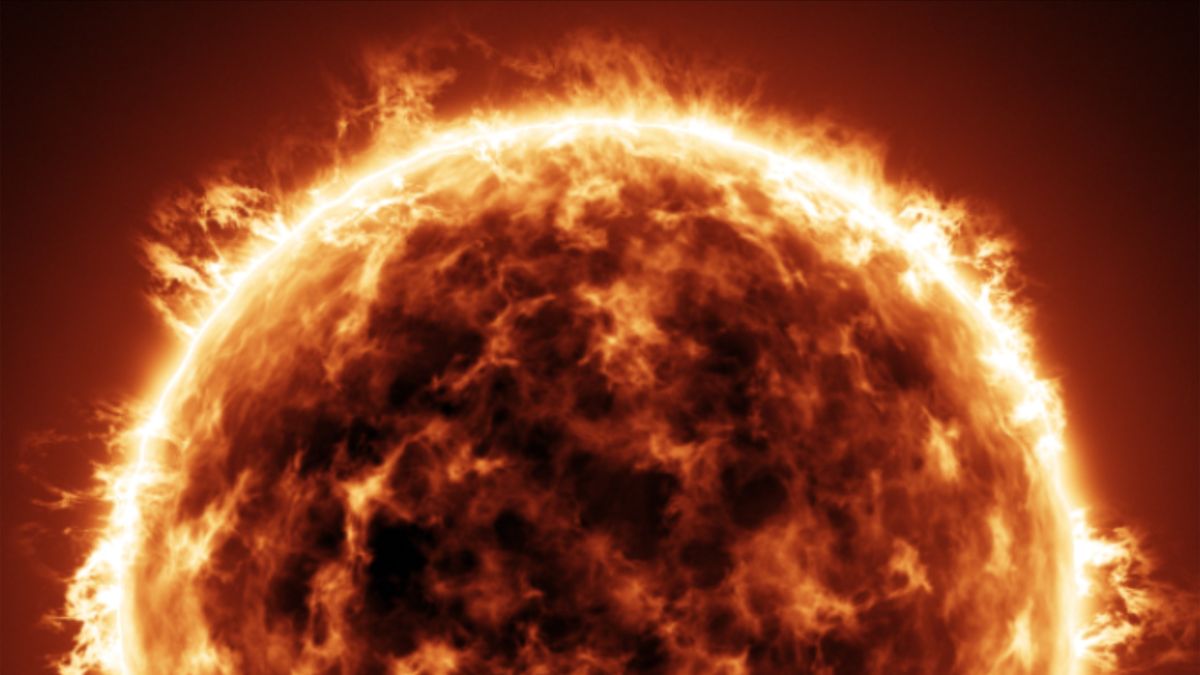 El sol con manchas claras y oscuras y hebras de partículas solares que se extienden desde la superficie.