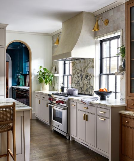 A neutral kitchen with marble window trim