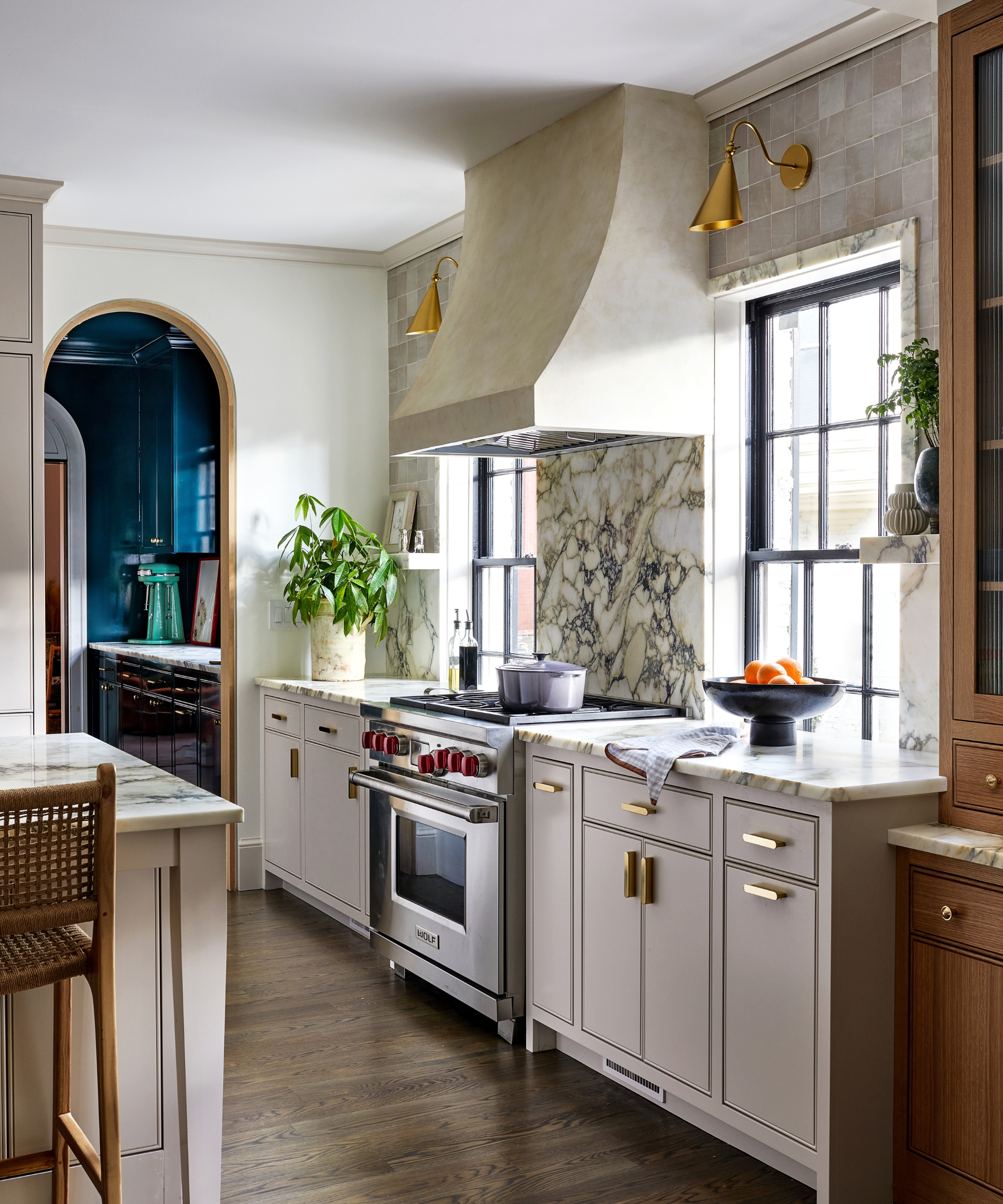 A neutral kitchen with marble window trim
