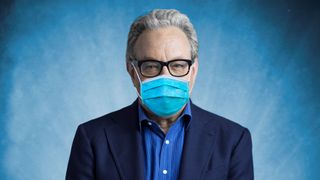 Lewis Black wearing a mask