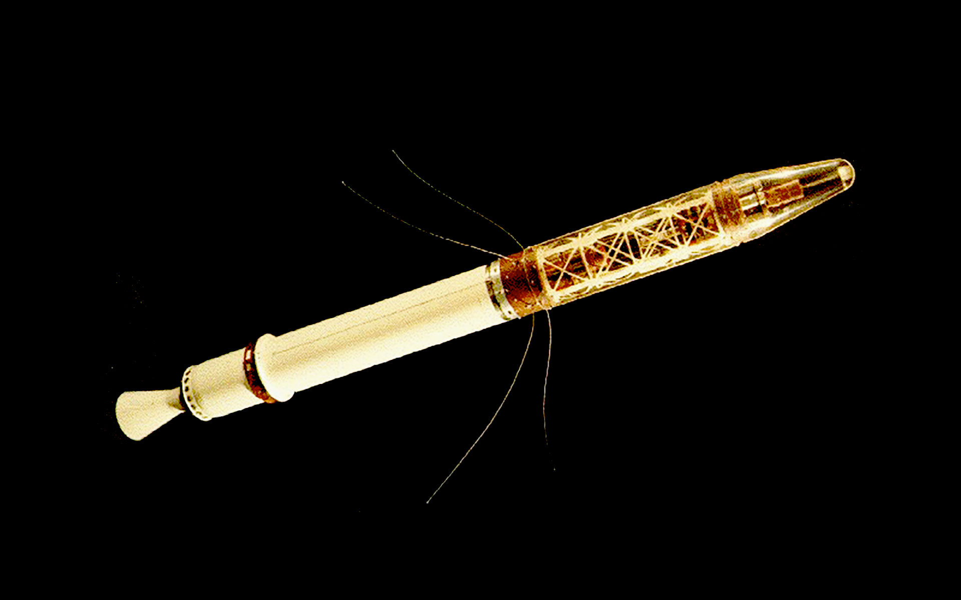 a satellite with a long body, an engine at one end and tapered nose at the other.