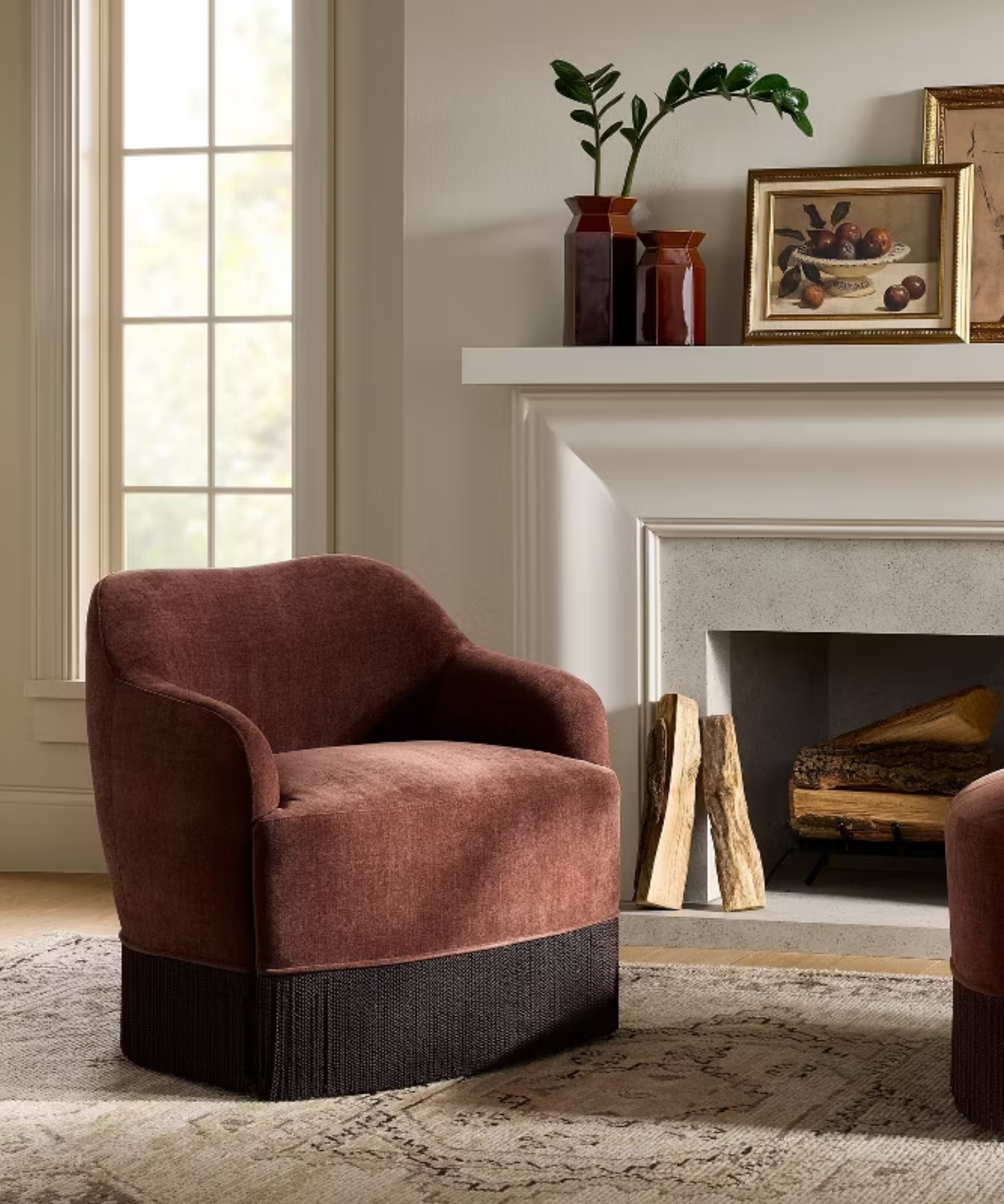 a living room with a maroon swivel chair in front of a fireplace