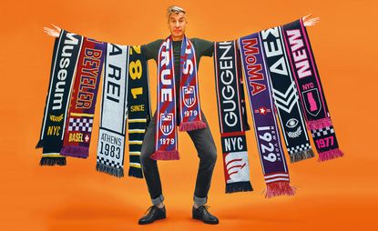 Maurizio Cattelan with some of his museum scarves