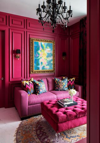 Raspberry pink living room with chesterfield sofa