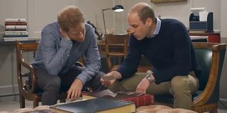 Prince Harry and Prince William looking at photos in Diana Our Mother