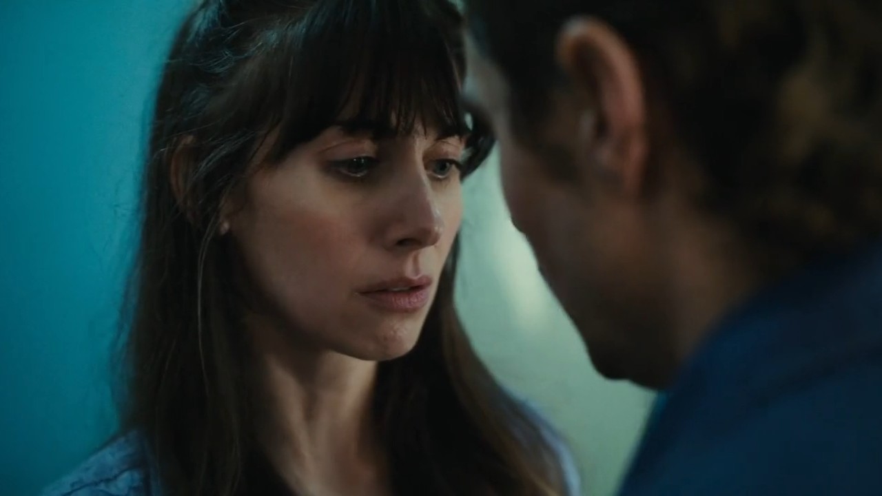 Alison Brie and Dave Franco looking at each other in Together.