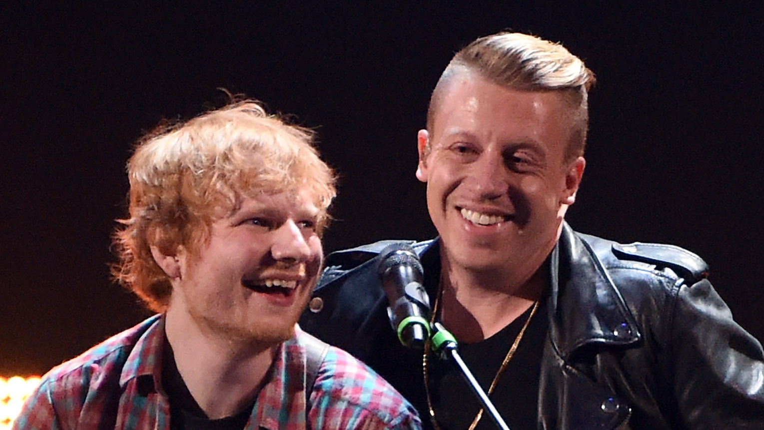 Singer/songwriter Ed Sheeran (L) and rapper Macklemore perform during the 2014 iHeartRadio Music Festival