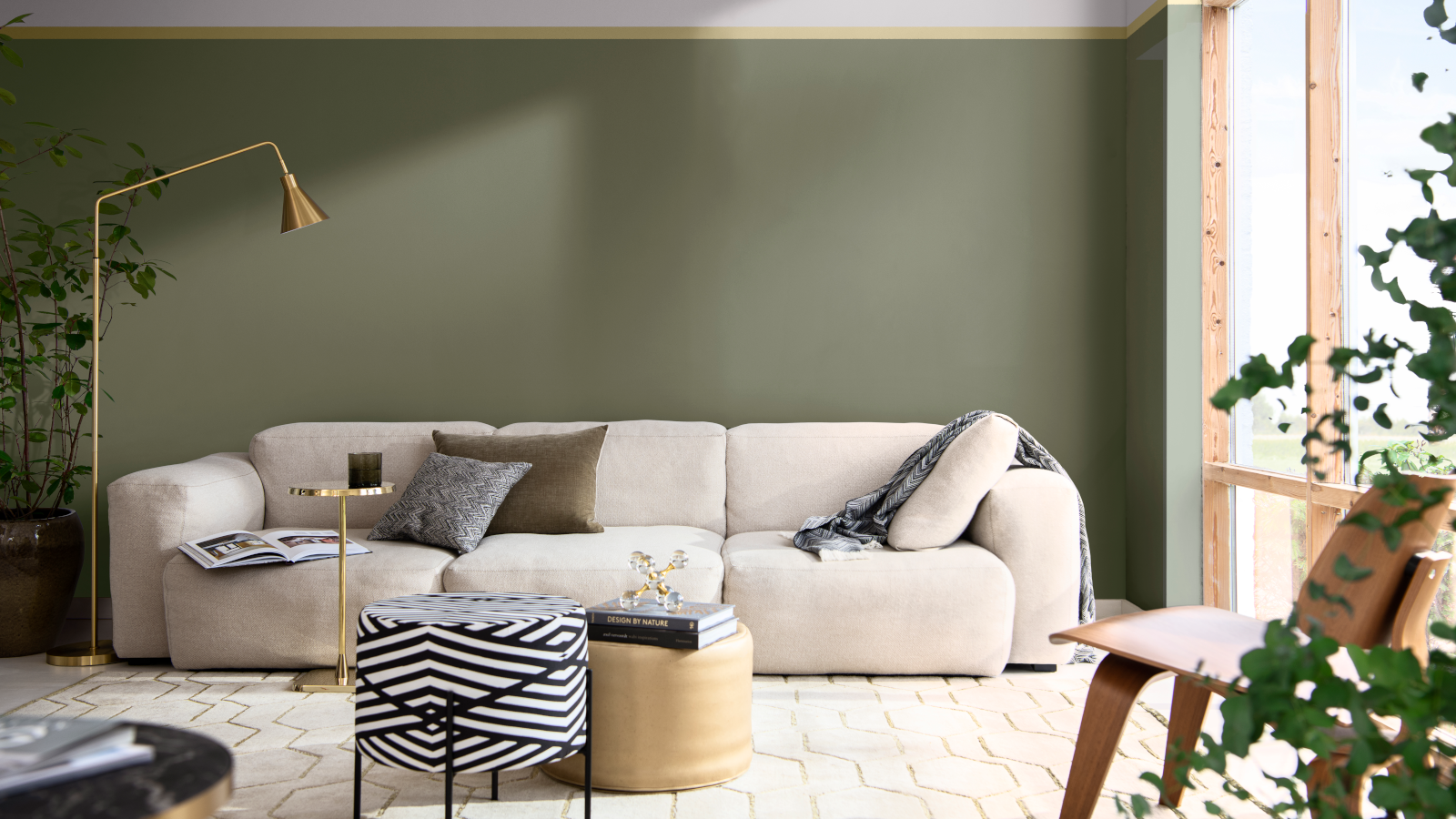 Green living room with white sofa and gold lamp