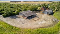 A building plot surrounded by a forest with full planning permission