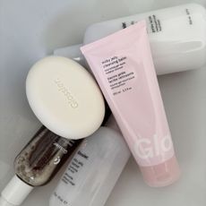 A lineup of Glossier cleansers, including the Glossier Milky Jelly Cleansing Balm