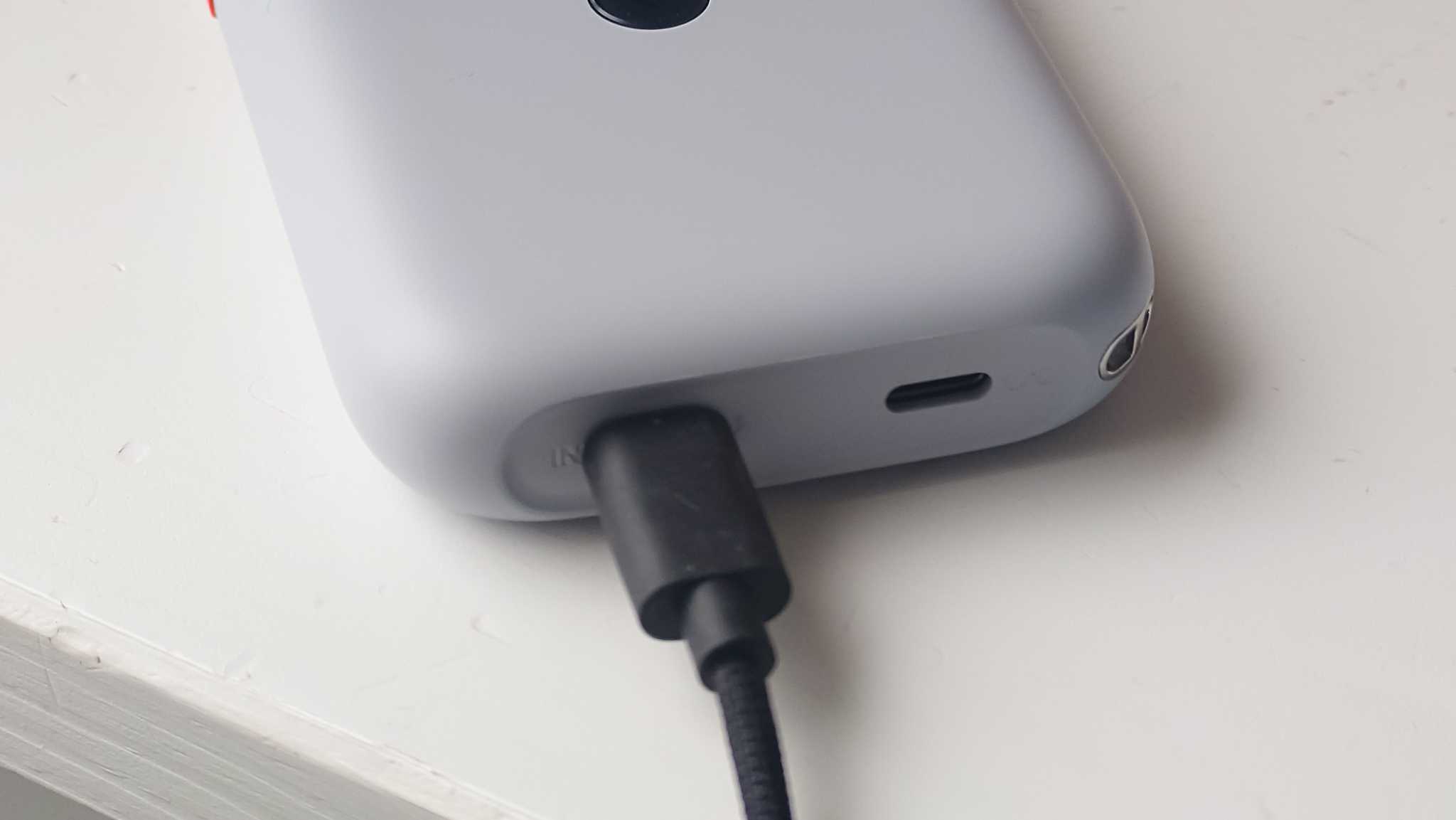 A USB-C cable connected to the XREAL Beam