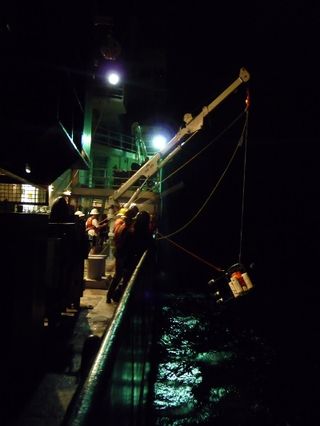 Researchers aboard the ship Revelle retrieve an instrument sent down into the Tonga Trench, the second deepest trench in the ocean, during an expedition in the summer of 2012.
