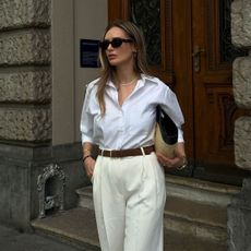 @oliviafaeh outfit photo in white button-down, belt, and trousers