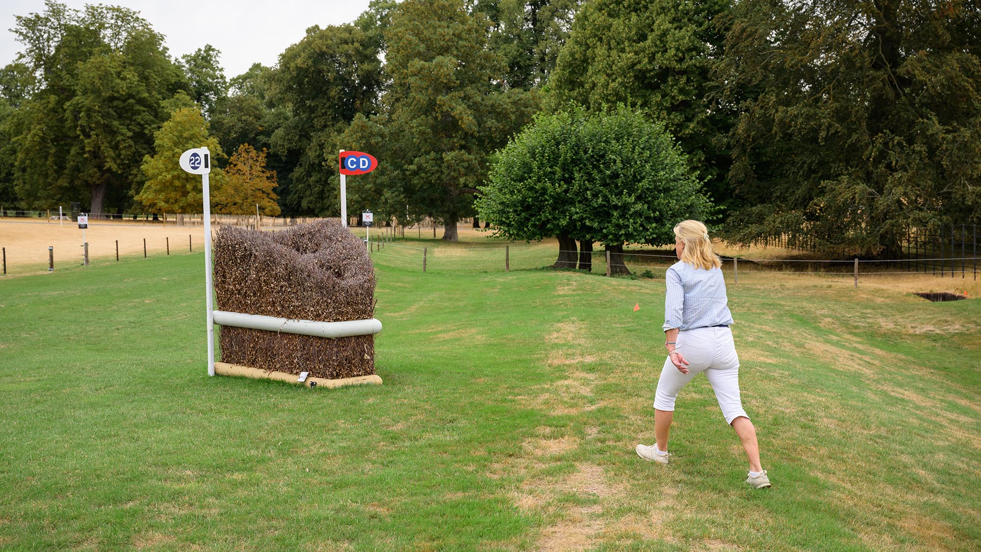 Event rider Tina Cook walking up to a triple brush arrowhead on the Burghley cross-country course 2026