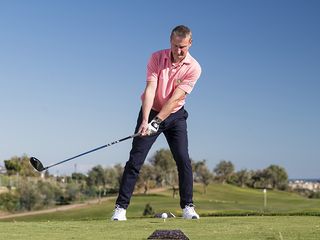 Anders Mankert demonstrating the incorrect way to start the backswing, with weight on the lead foot and the clubhead picked up too quickly