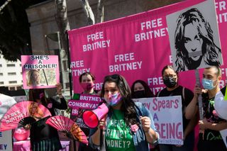 What is a conservatorship? Supporters of the FreeBritney movement rally in support of musician Britney Spears following a conservatorship court hearing in Los Angeles, California on March 17, 2021. - Free Britney supporters of fans of Spears have closely followed her conservatorship case and rallied that the pop singer should be legally allowed to decide her own affairs. (Photo by Patrick T. FALLON / AFP) (Photo by PATRICK T. FALLON/AFP via Getty Images)